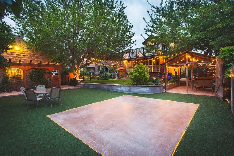Backyard space lit up with lighting for the evenings