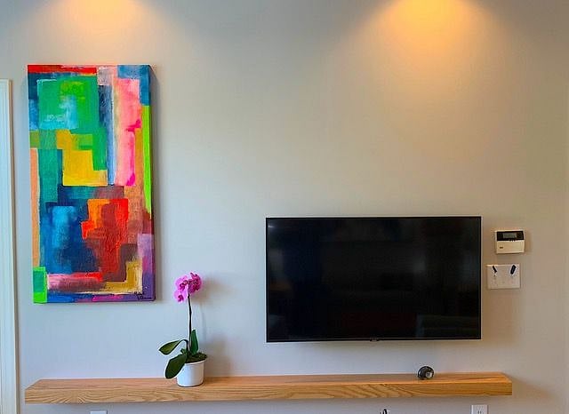 50" smart TV with cable, another TV in bedroom