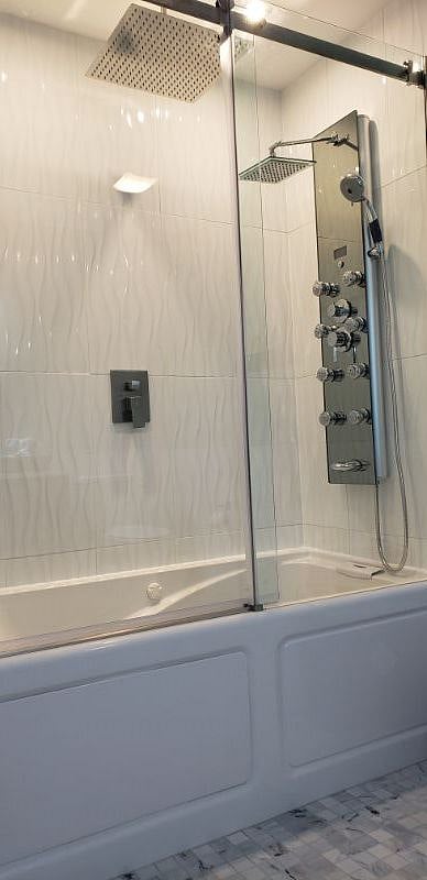 Spacious bath-tub with pressure jets and a custom shower