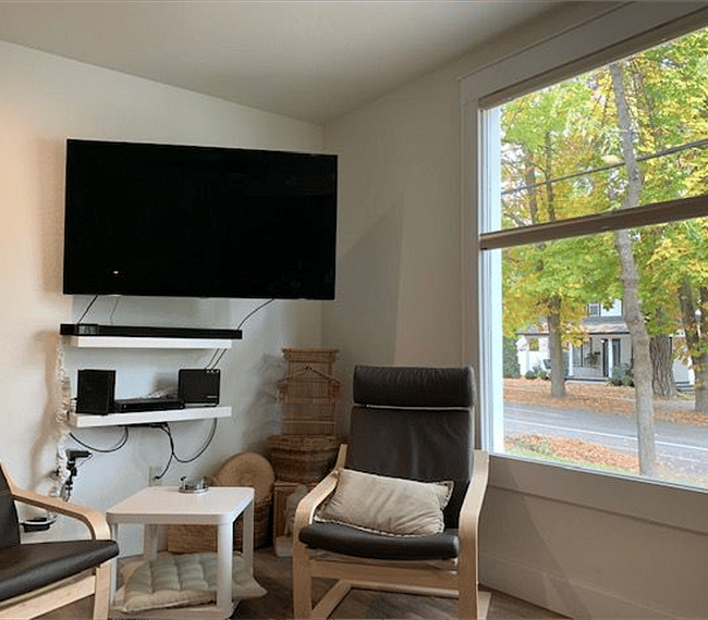 Settle in and watch a movie on the flat screen TV