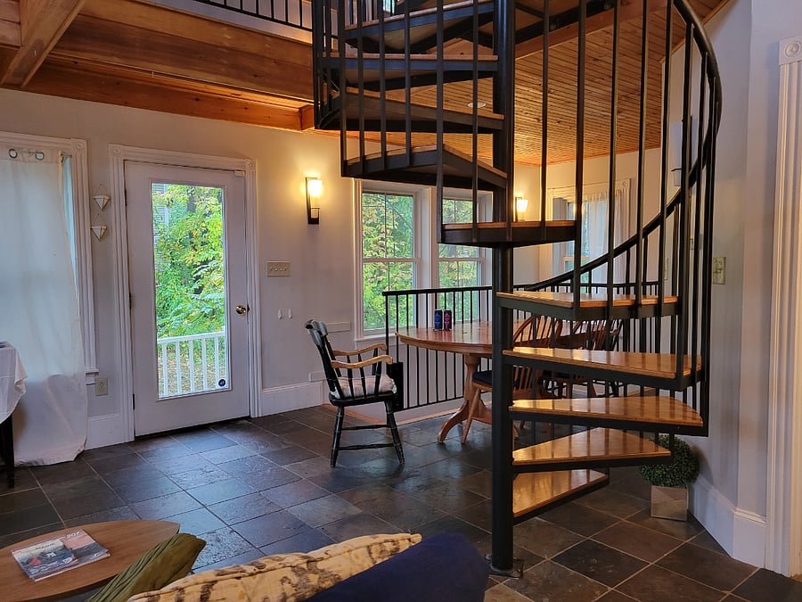 Main entrance, dining area & staircase to loft.