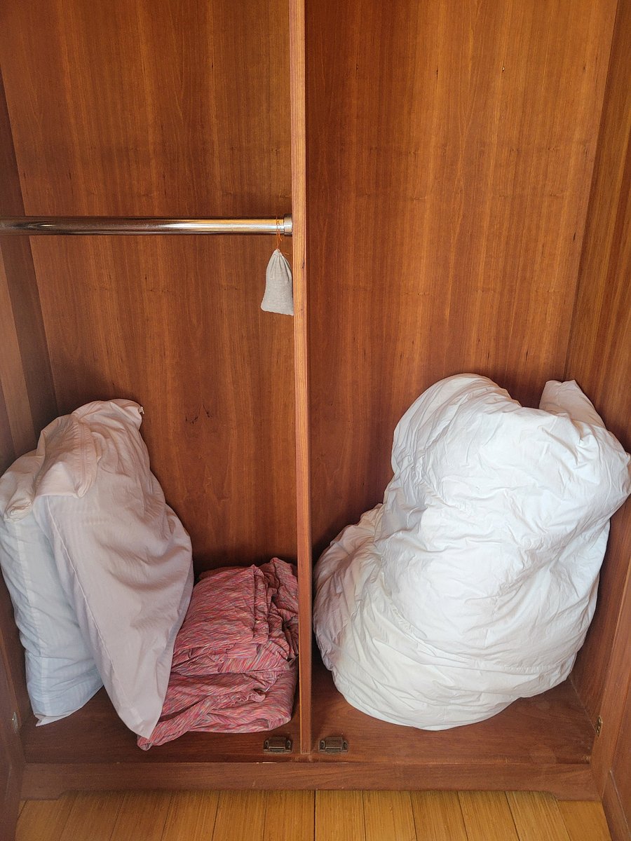 Inside of one cherry armoire.