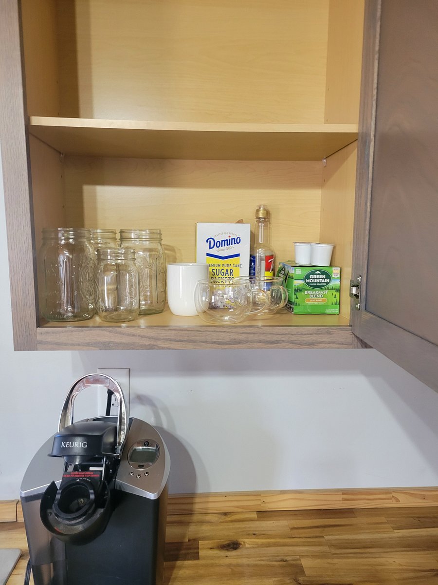 Coffee maker & kitchen cabinets.