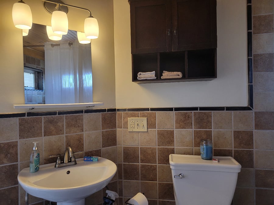 Toilet, sink & wall cabinet.