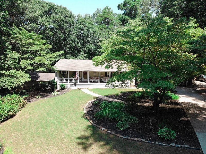 Front of our home has large front porch on large lot with plenty of parking.