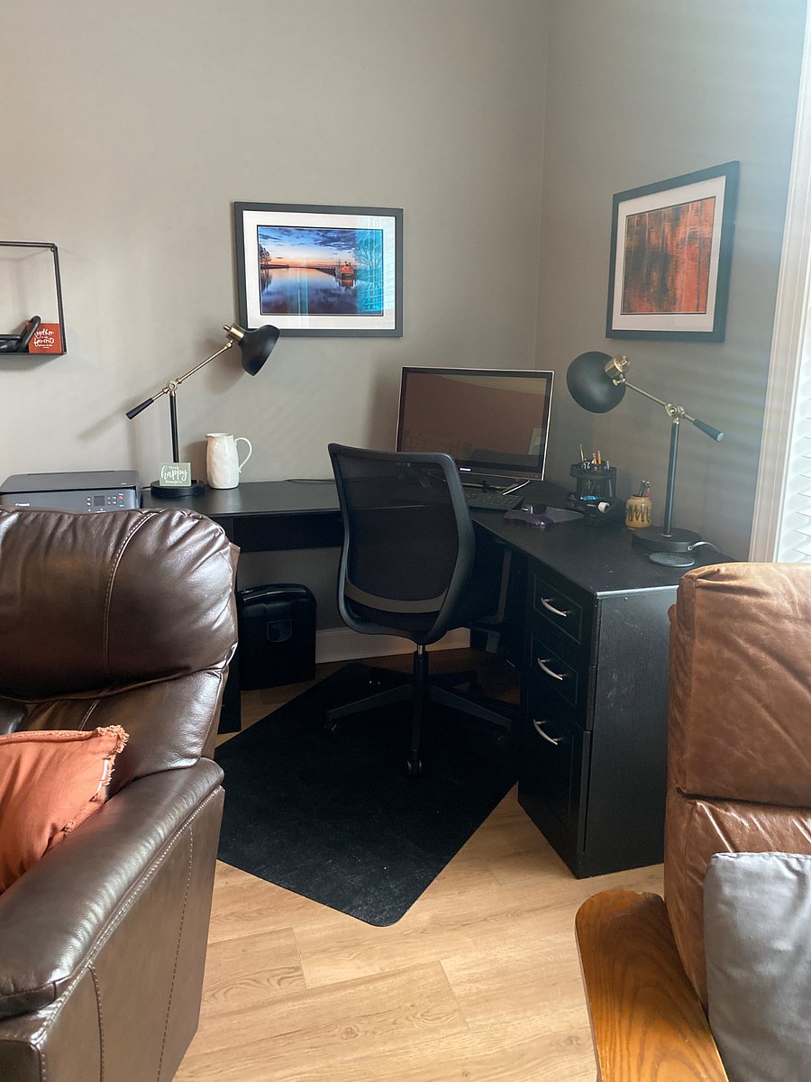Computer desk in living room (computer will be moved for your convenience)