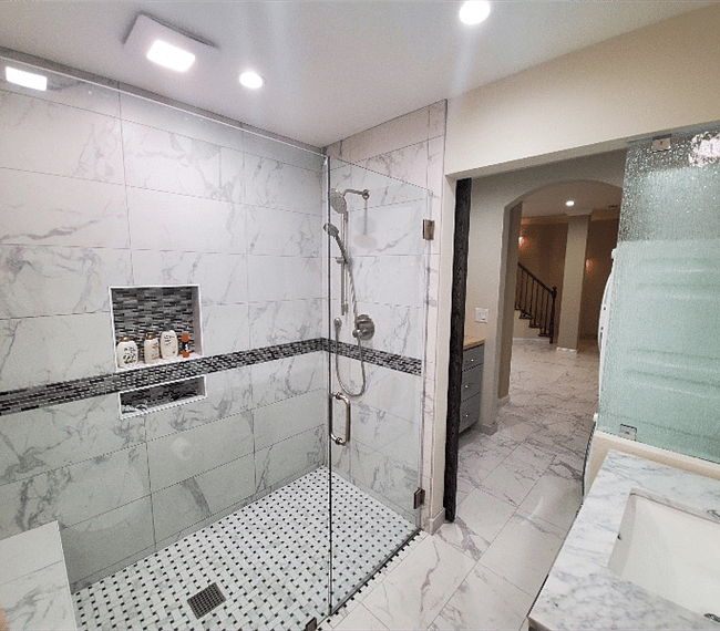 The bathroom is modern and stylish with shower, toilet and vanity