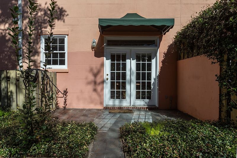 Exterior courtyard private seating area. Not pictured here, but there is a fire pit and egg-nest style chair here for seating!