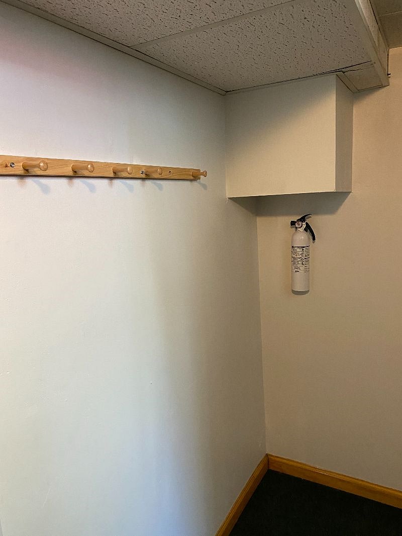 Entry coat rack and extinguisher
