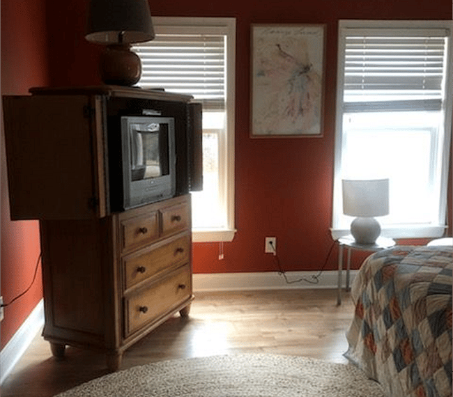 Settle in and watch a movie on the flat screen TV