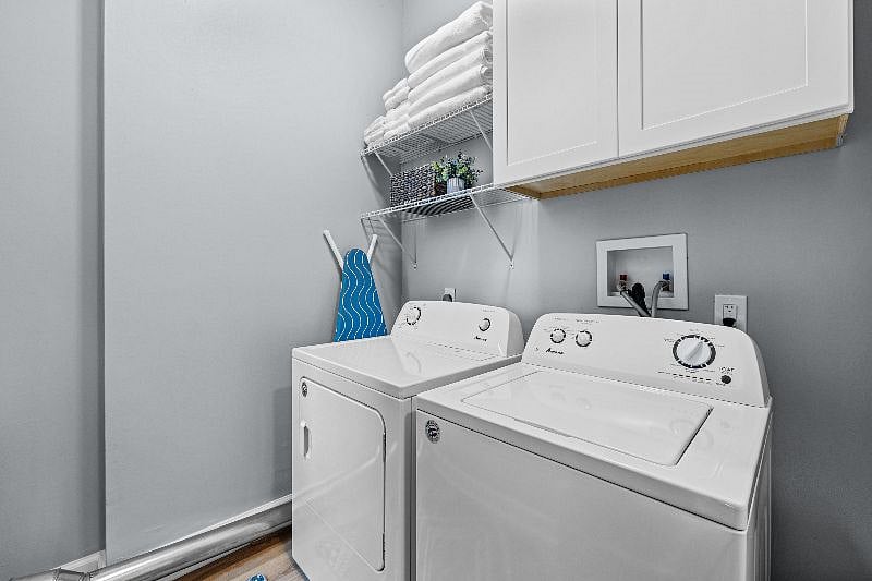 Full size washer and dryer.  Ironing board and iron provided.