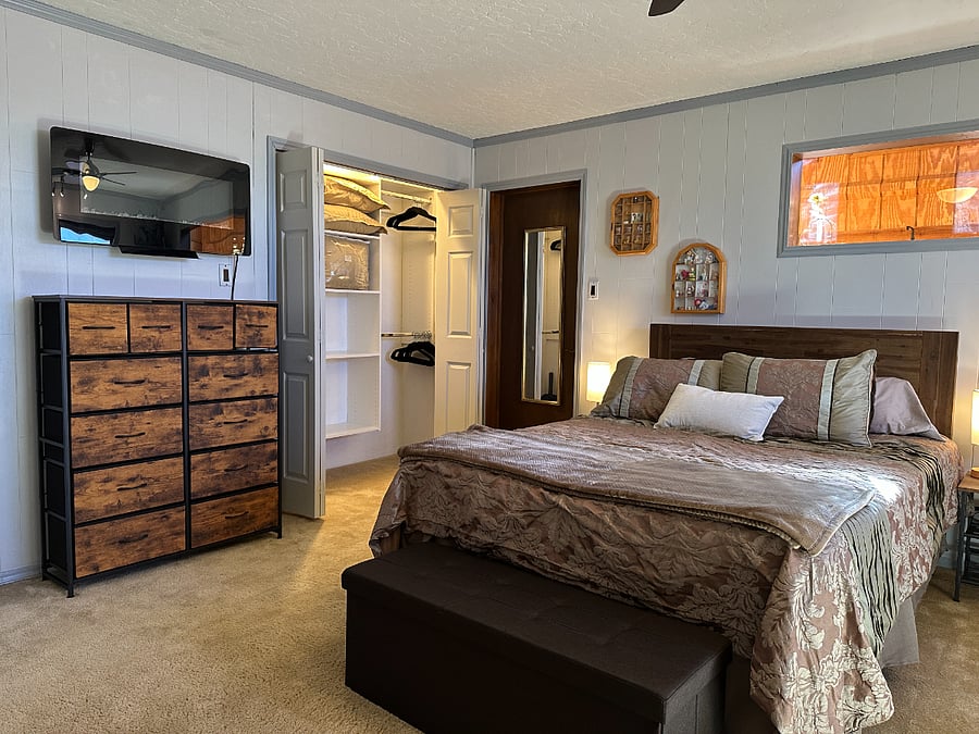 Queen mattress and custom closet in the large guest bedroom