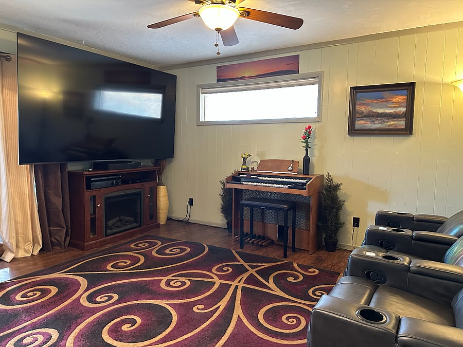 100" HDTV in theater room with 3 comfortable recliners