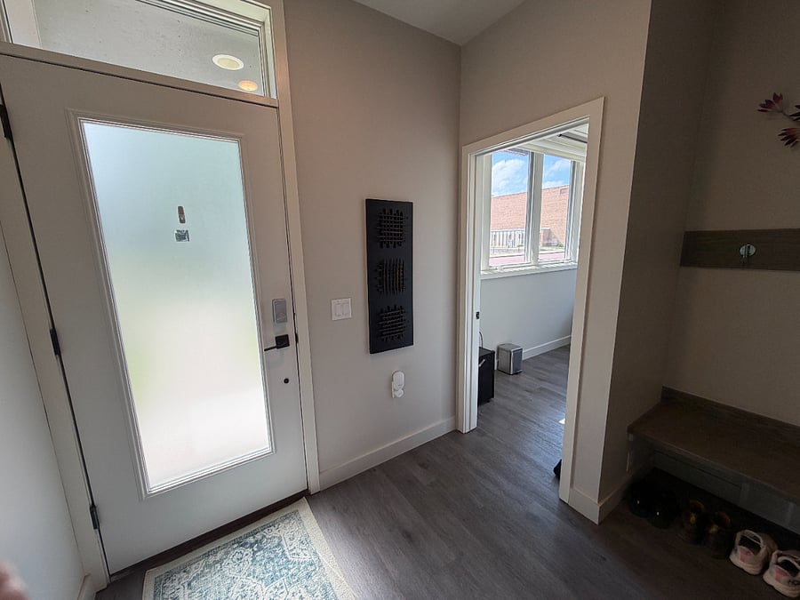 This room is right inside the front door to the townhome. It is the only bedroom on the ground level.