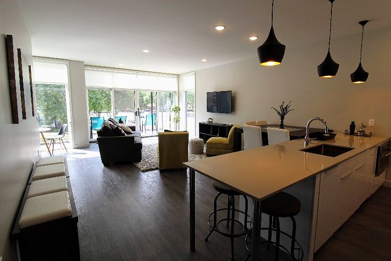 Shared common area including living room and full kitchen.