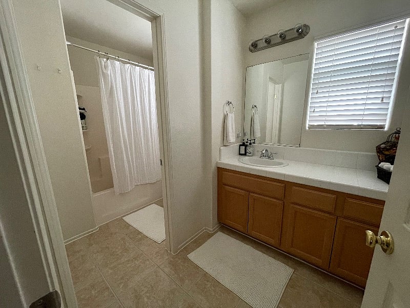 Large shared bathroom with tub/shower.