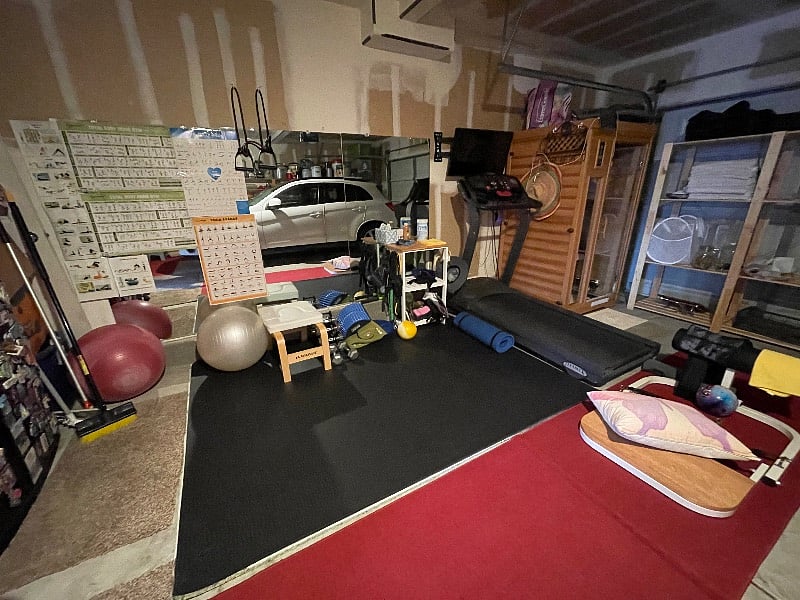 Garage area with yoga studio, treadmill, weights and all sorts of workout toys. Including a butt-building machine.