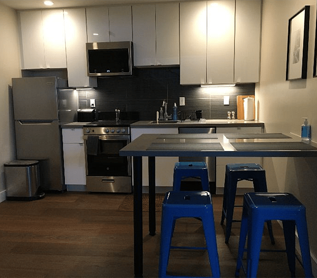 New kitchen - full size microwave, fridge, stove.  Dishwasher.  Island for dining - seating and settings for four.