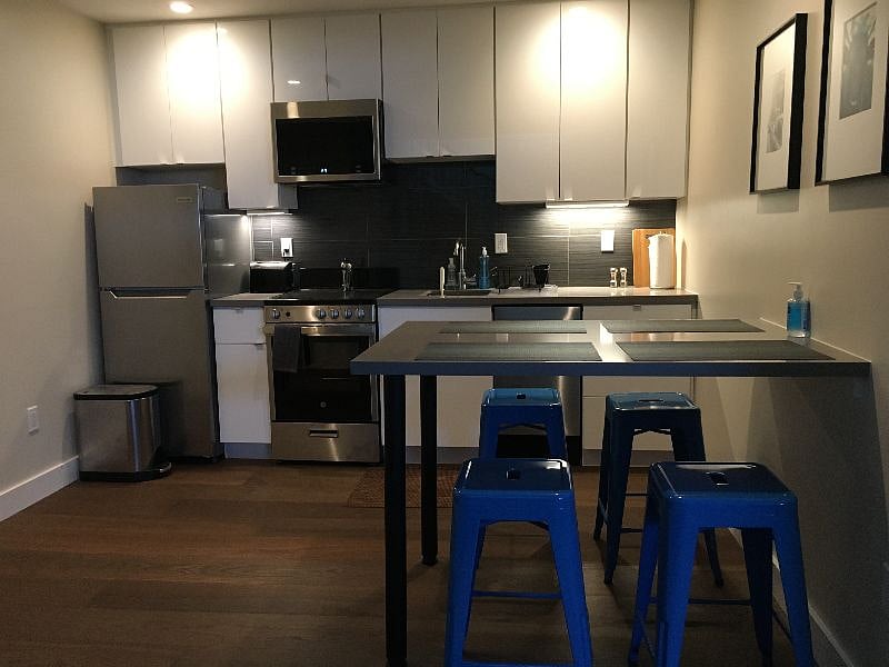 Kitchen with island dining and settings for 4