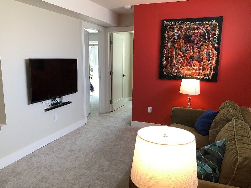 Spacious light filled den looking towards bedrooms