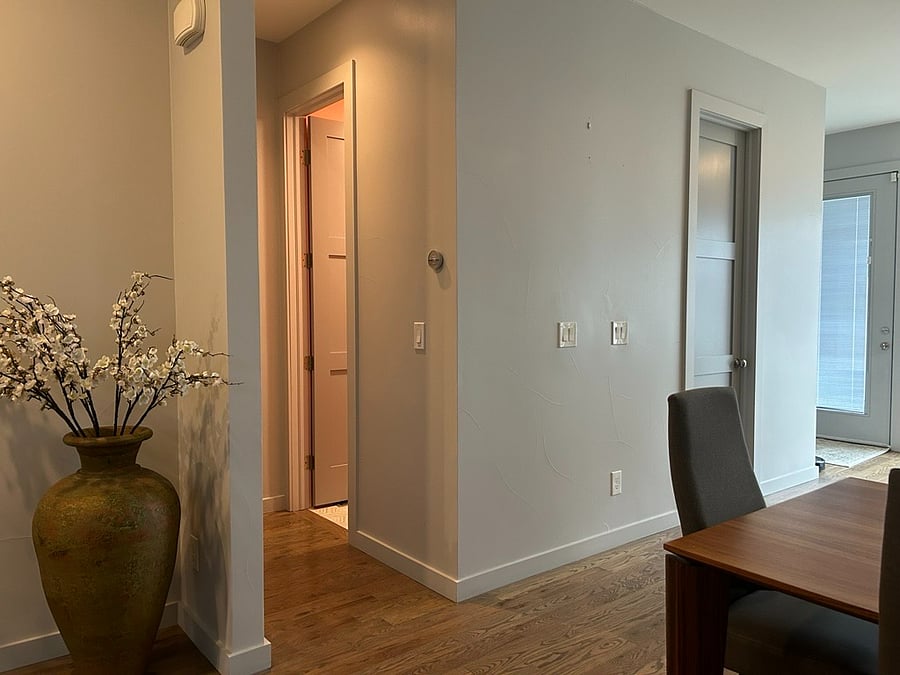 Powder room is the door on the left in the hallway, pantry is door on the right,