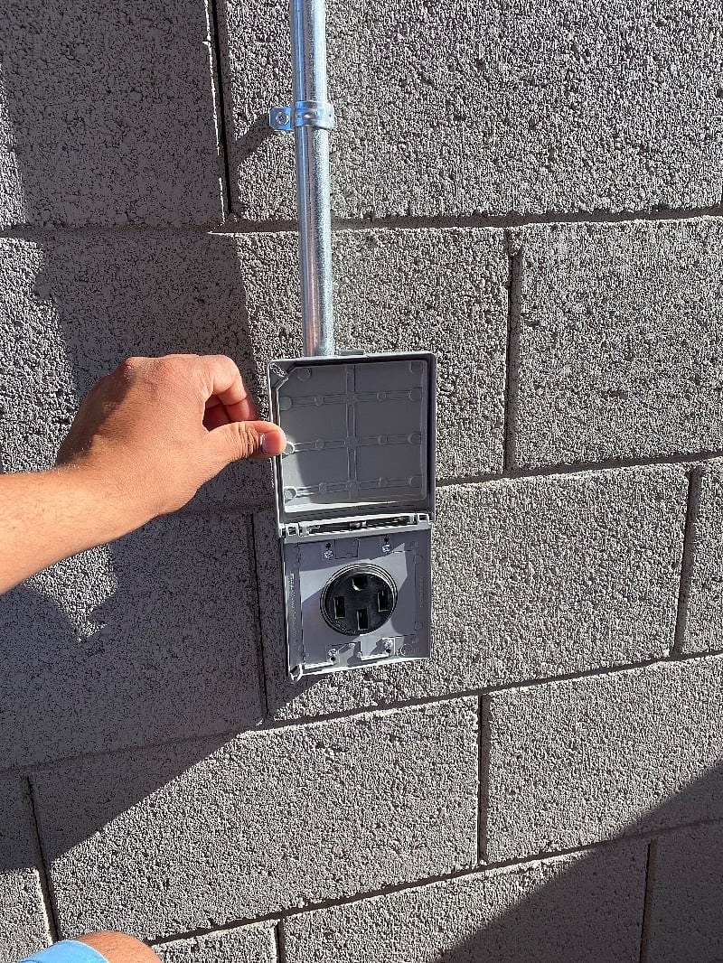 50A outlet for charging your EV. Bring your own cord (15 ft length).