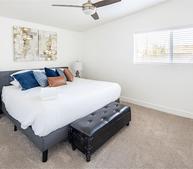 King size bed in the primary bedroom. This room has 1 standard closet and one walk-in closet. 