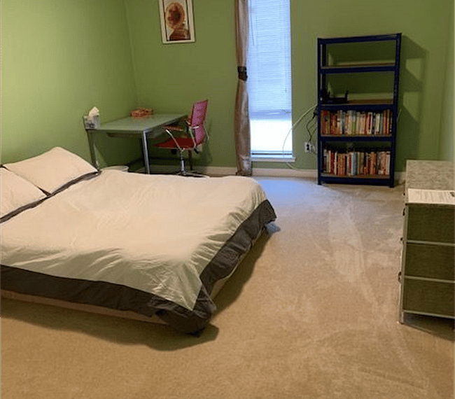 Bedroom #2 with desk, office chair, book shelf and window