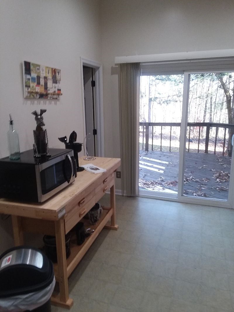 Mico wave, toaster, personal K Cup, counter space. Note the Fondu pot and sticks!! Door to left to launder, and sliding door to private outdoor deck for relaxing and cooking on included grill..