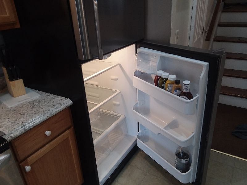 Stainless steel fridge with essential condiments, Sweet Baby Rays Included!!