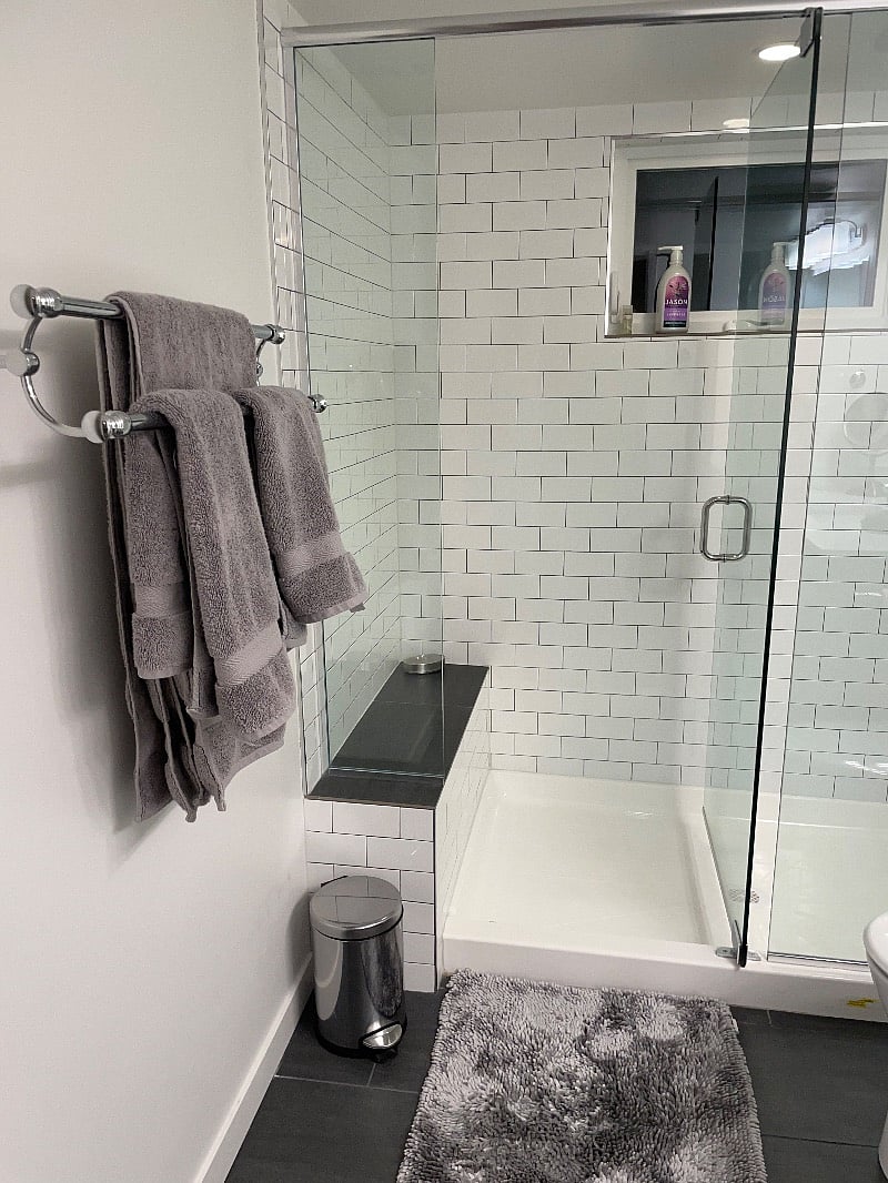 Nice new shower and bathroom with heated floors and window in bathroom.