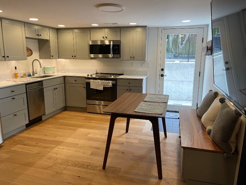 Bright, full windowed door and nice lighting add to this units decor. Cozy basement also contributes to cooler temperatures.