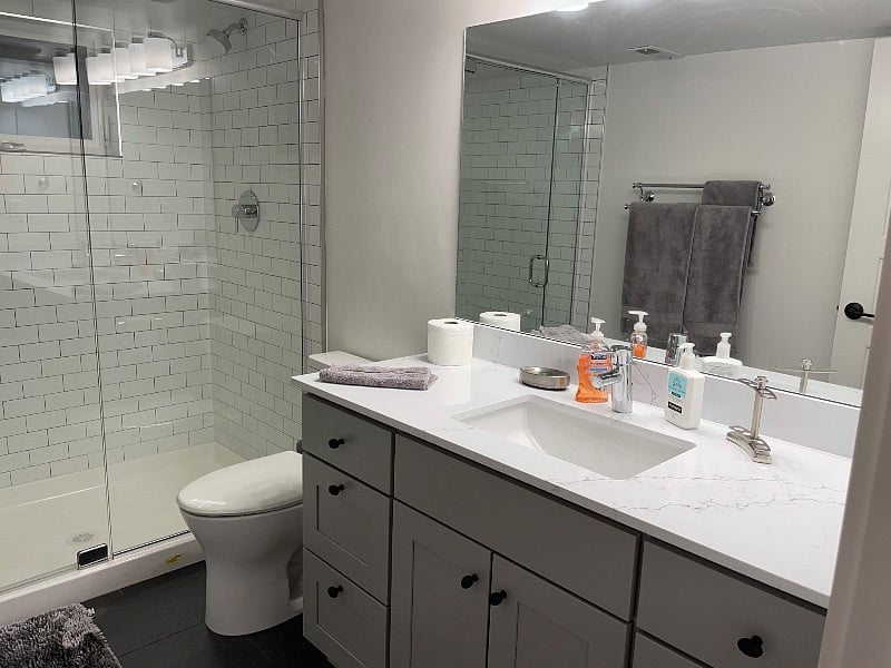 Heated floors, large mirror and counter tops. Window in bathroom for good ventilation as well as fan.