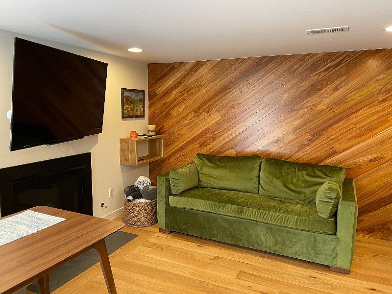 Peruvian decorative hardwood wall and hardwood floors throughout. Sofa pull out bed and couch.