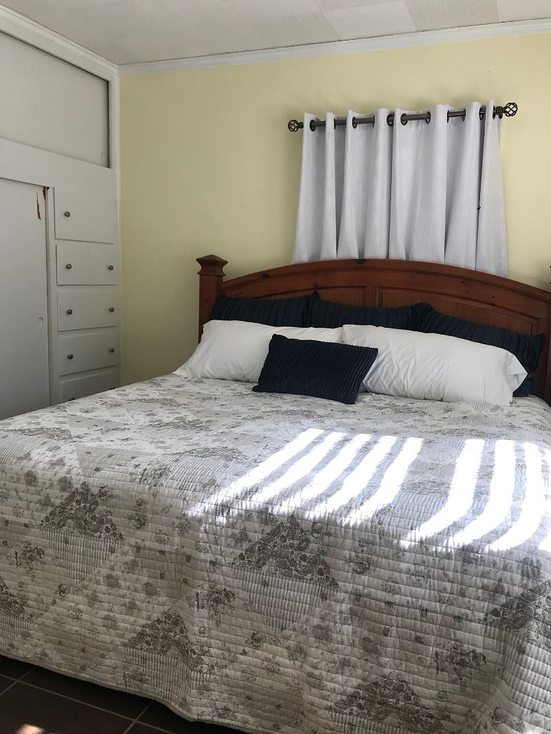 Master bedroom with King bed and built-in closet system