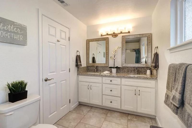 Master bathroom double vanity with granite countertops