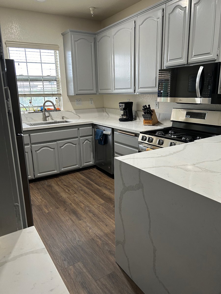 New countertops, floor, and appliances.