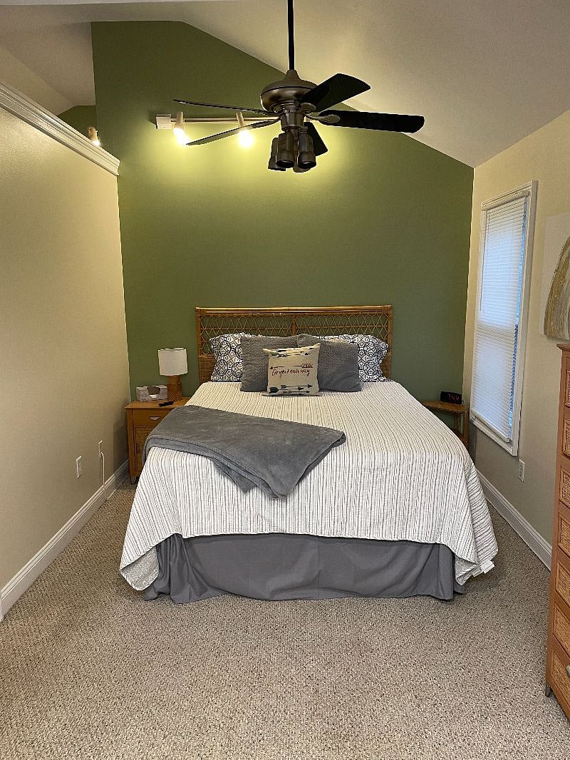 Master bedroom with queen size bed, tv and large closet
