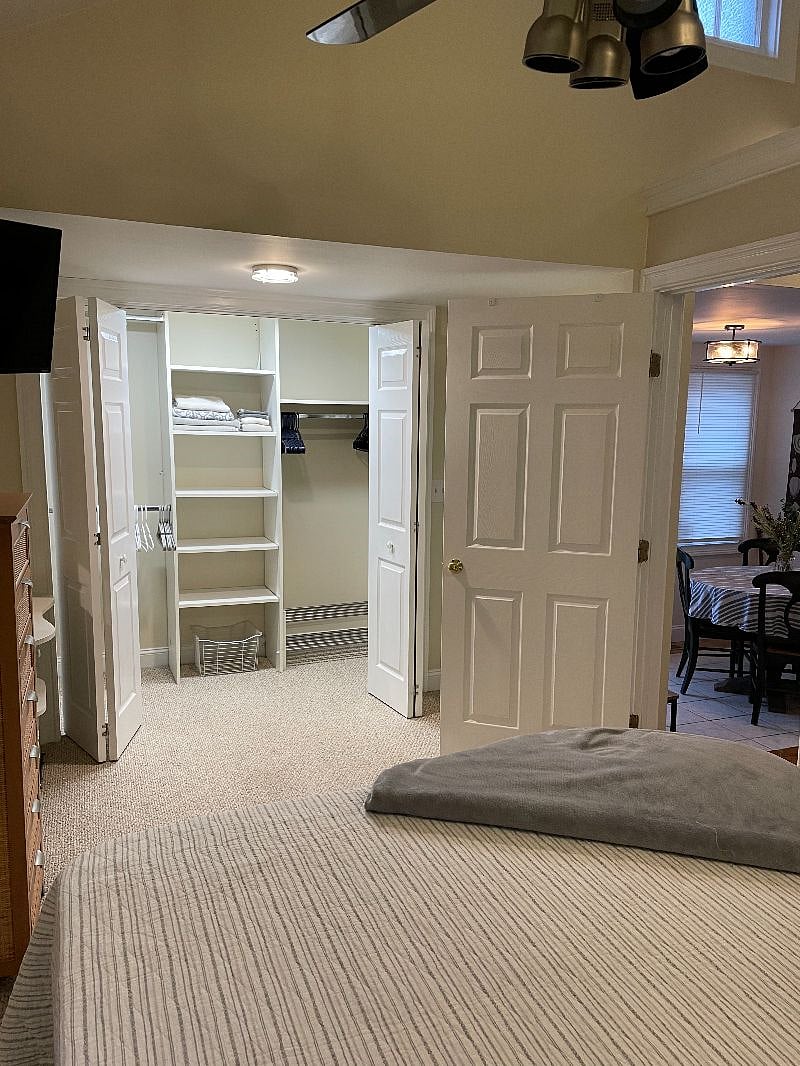 Very large closet with organizer shelving