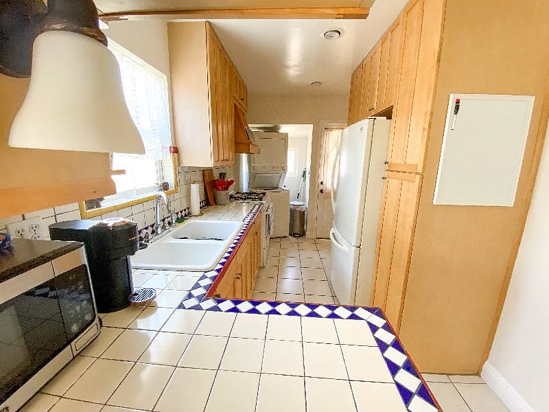 Full sized kitchen with Nespresso and in unit Laundry