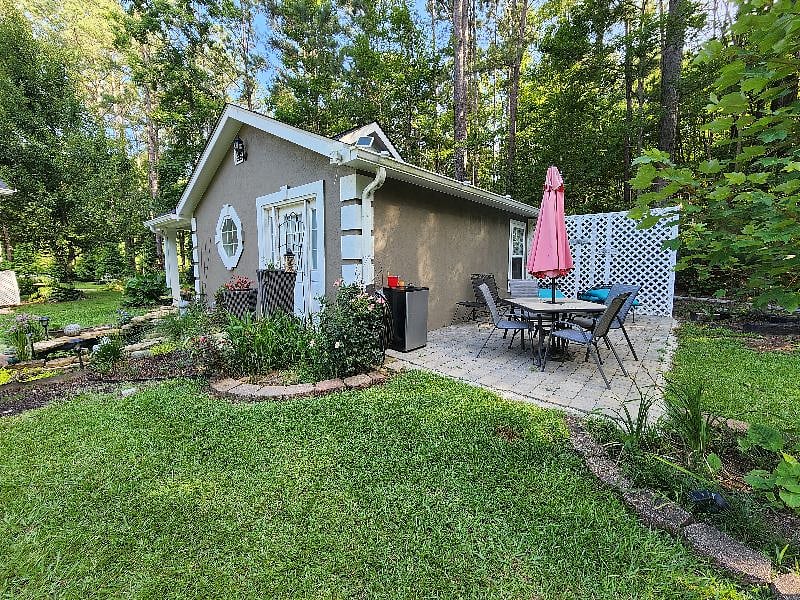 Private patio with gas grill, table and chairs