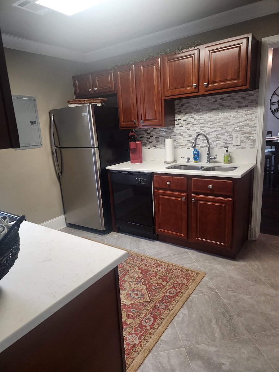 Full size refrigerator with ice maker in large kitchen