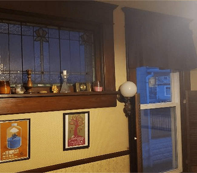 more stained glass overlooking formal dining room