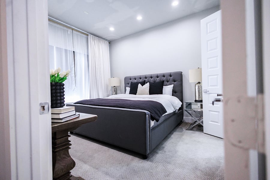 3rd floor master bedroom with king size bed, walk in closet, and en suite bathroom.