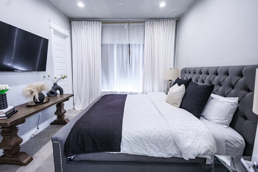 3rd floor master bedroom with king size bed, walk in closet, and en suite bathroom.