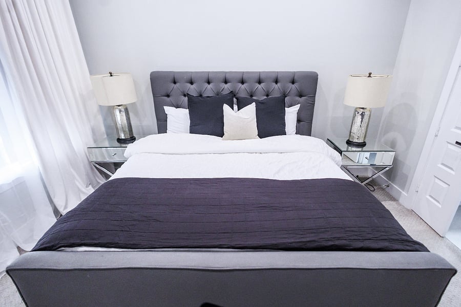 3rd floor master bedroom with king size bed, walk in closet, and en suite bathroom.
