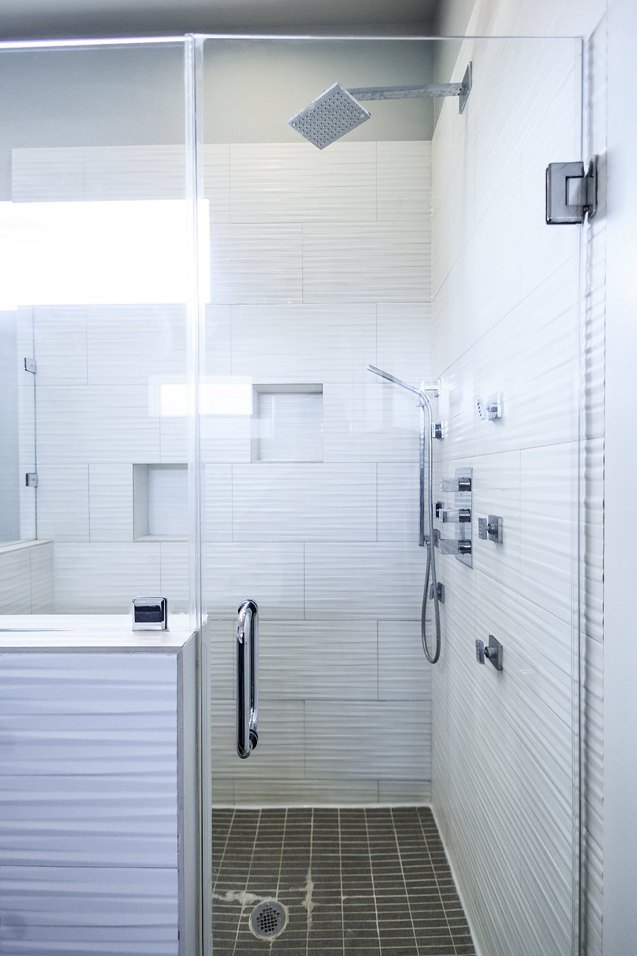 Primary bedroom en suite bathroom with upgraded shower system and walk in shower.  Separate soaker tub, double vanity, and private toilet area available.