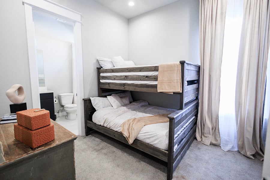 3rd floor guest room with sturdy, wooden bunk beds (twin over full).   Spacious closet and en suite bathroom.
