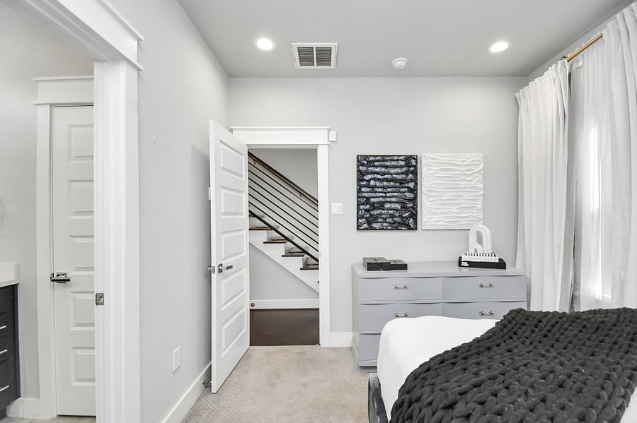1st floor bedroom with queen bed, dresser, and en suite full size bathroom.