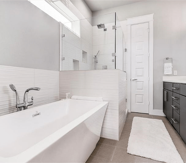 Primary bedroom en suite bathroom with upgraded shower system and walk in shower.  Separate soaker tub, double vanity, and private toilet area available.